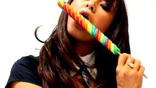 Seductive amateur British schoolgirl Natalia sucking a long lollipop with lust