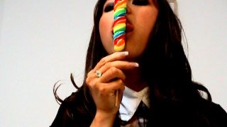 Amazingly brunette amateur British teen babe Natalia Blue sucking a long lollipop with lust